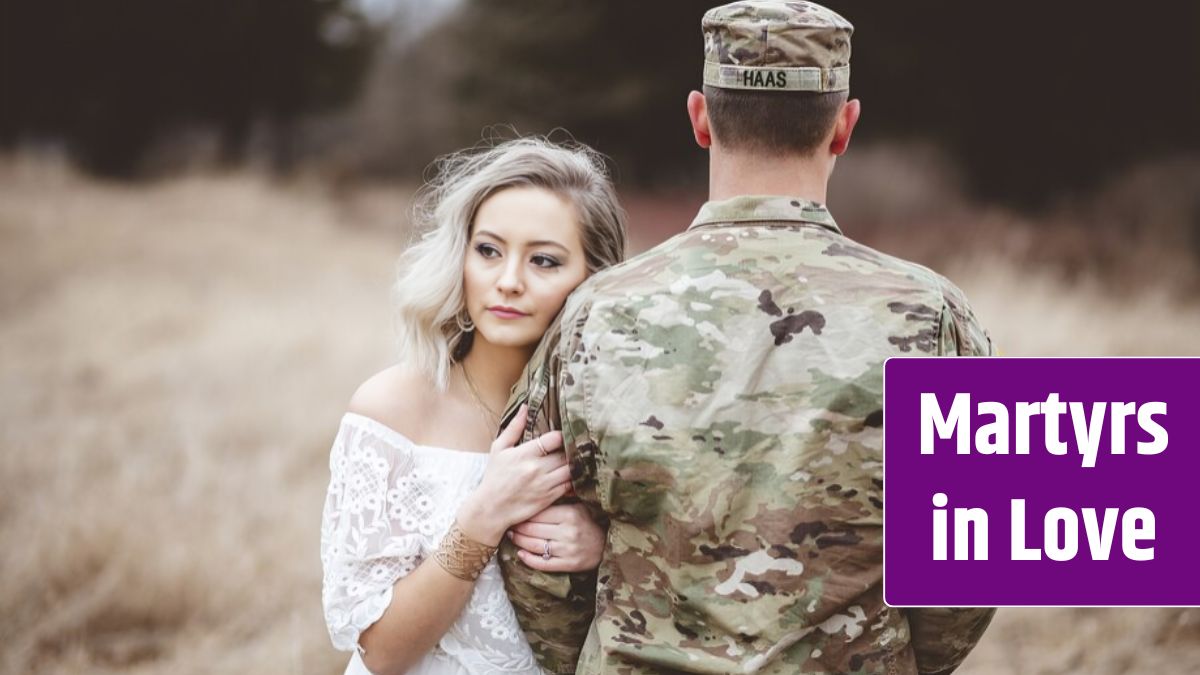 American soldier with his loving wife standing in a dry grassy field.